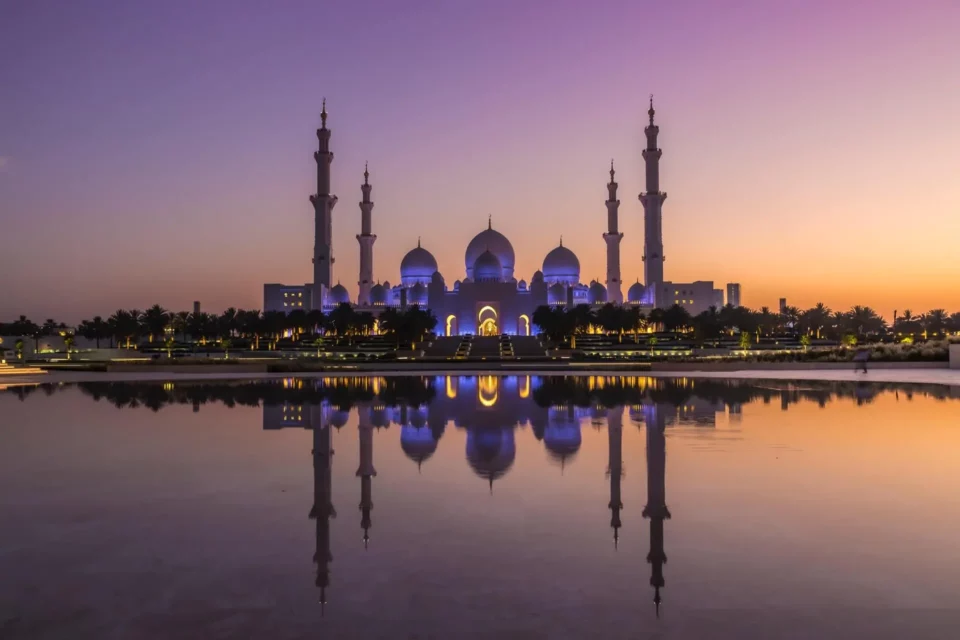 a view of the Sheikh Zayed Grand Mosque in Abu Dhabi from the water