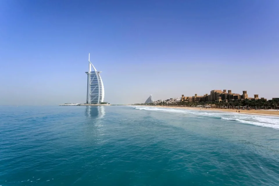 a view of the Burj-al-Arab from the sea in Dubai, UAE