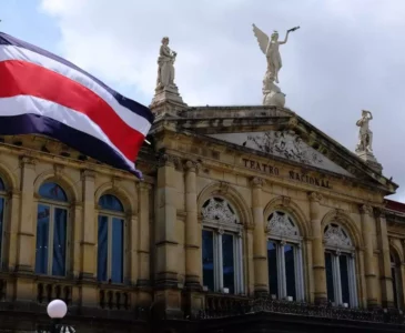 Costa Rican flag in front of a government building