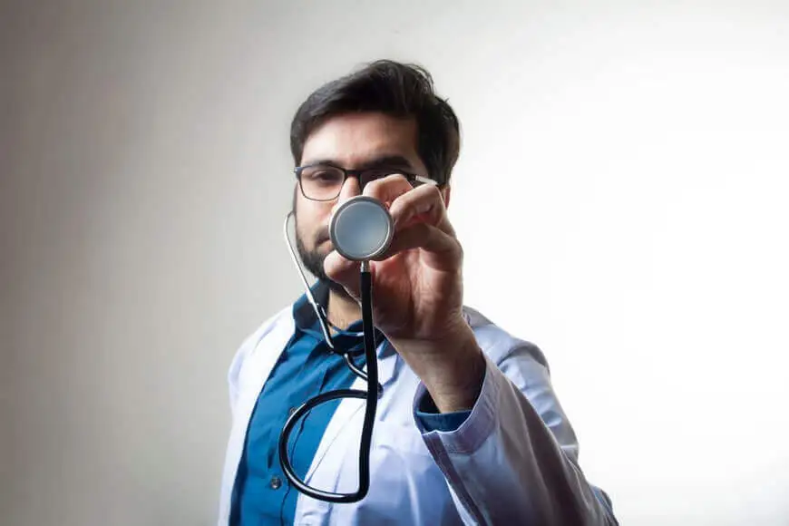 a doctor holding a stethoscope after moving abroad 