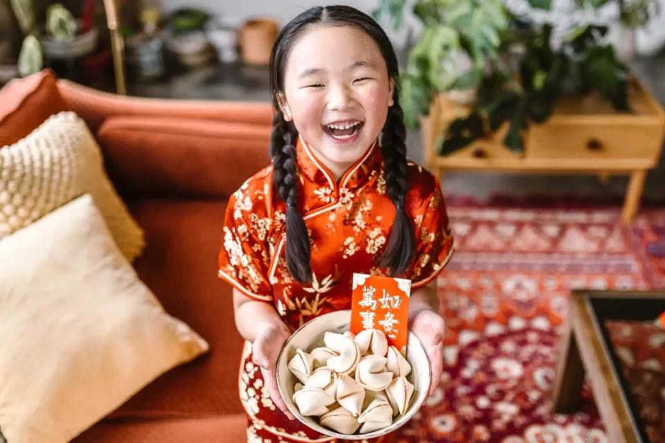 Girl holding fortune cookies  