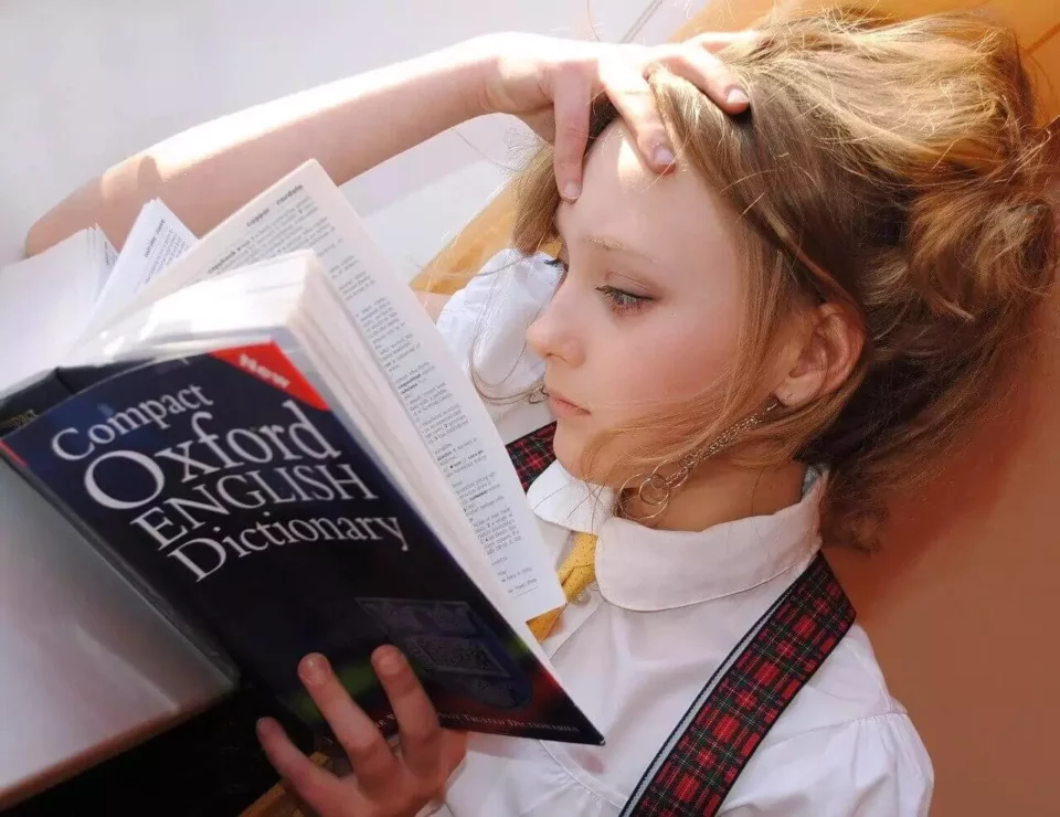 A girl reading the English dictionary