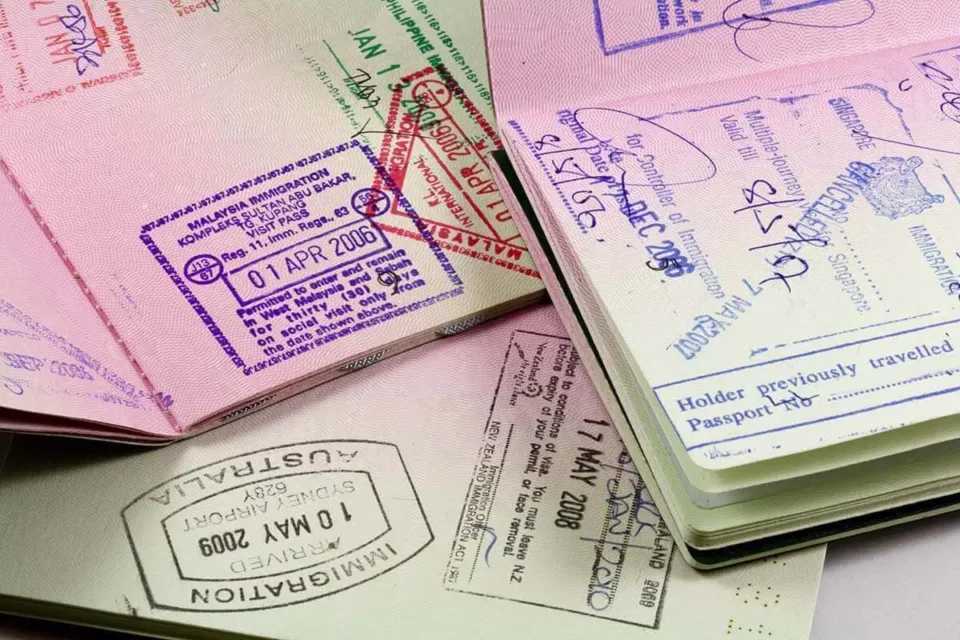 passport full of visas ready for international moving 