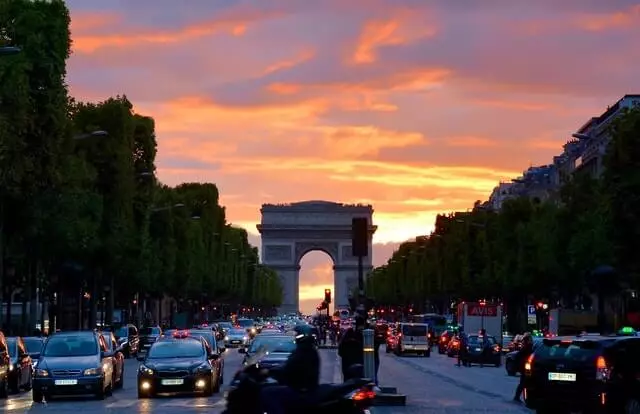 Traffic on Champs Élysées, with Arc-de-Triomphe in the back