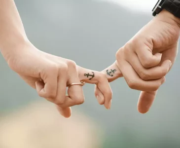 couple holding by their fingers