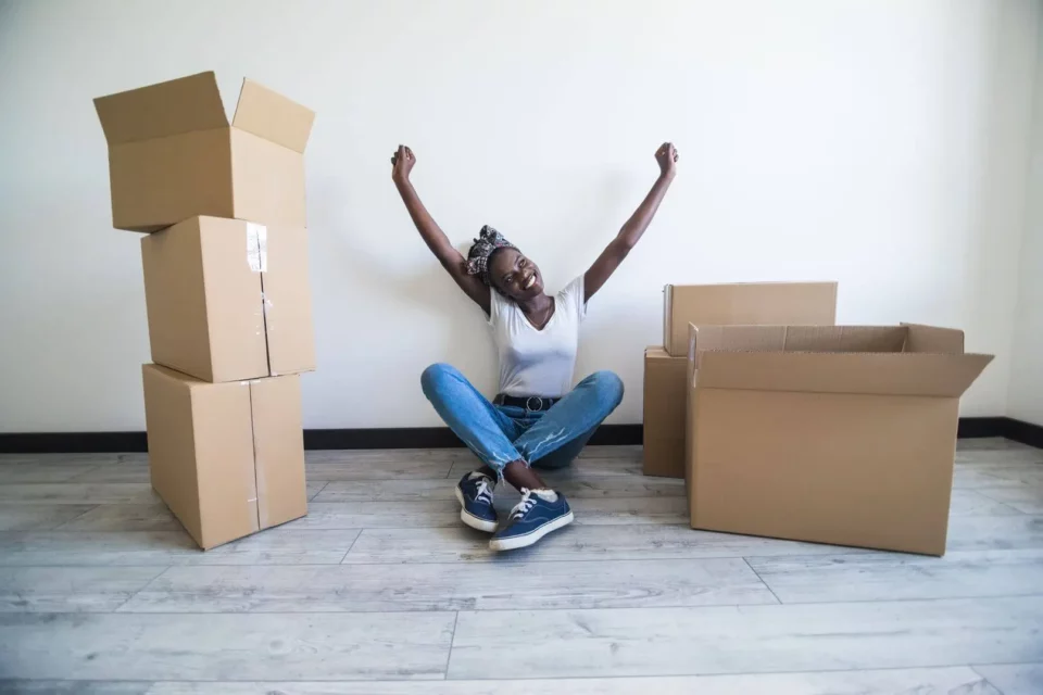 Woman celebrating after successful moving abroad