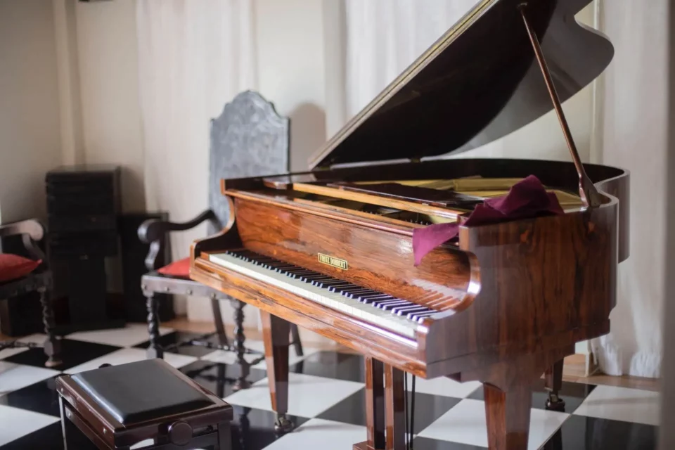 A picture of a brown grand piano