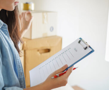 woman holding moving checklist